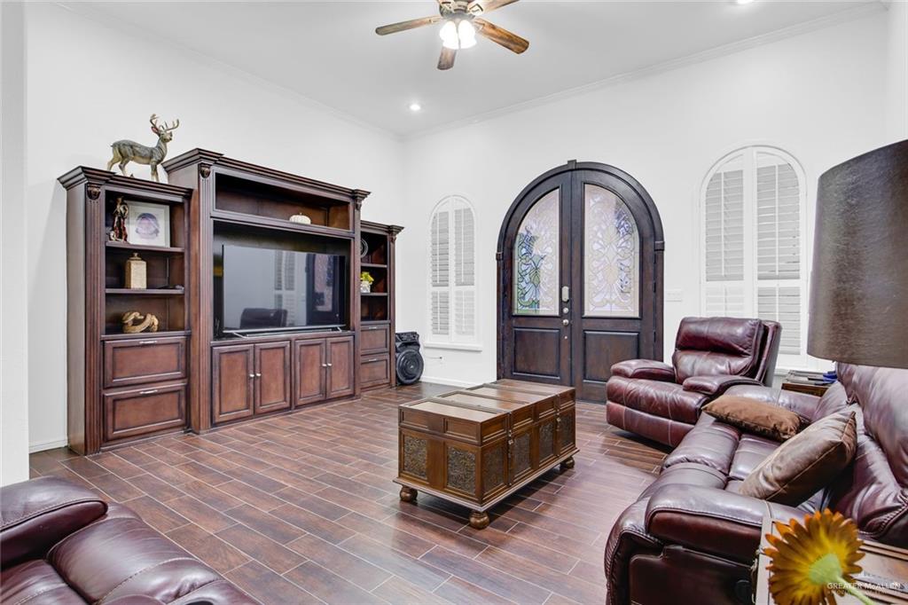 2405 West Rhin Drive Edinburg, TX 78539 - Photo 12 of 26 a living room with furniture and a flat screen tv
