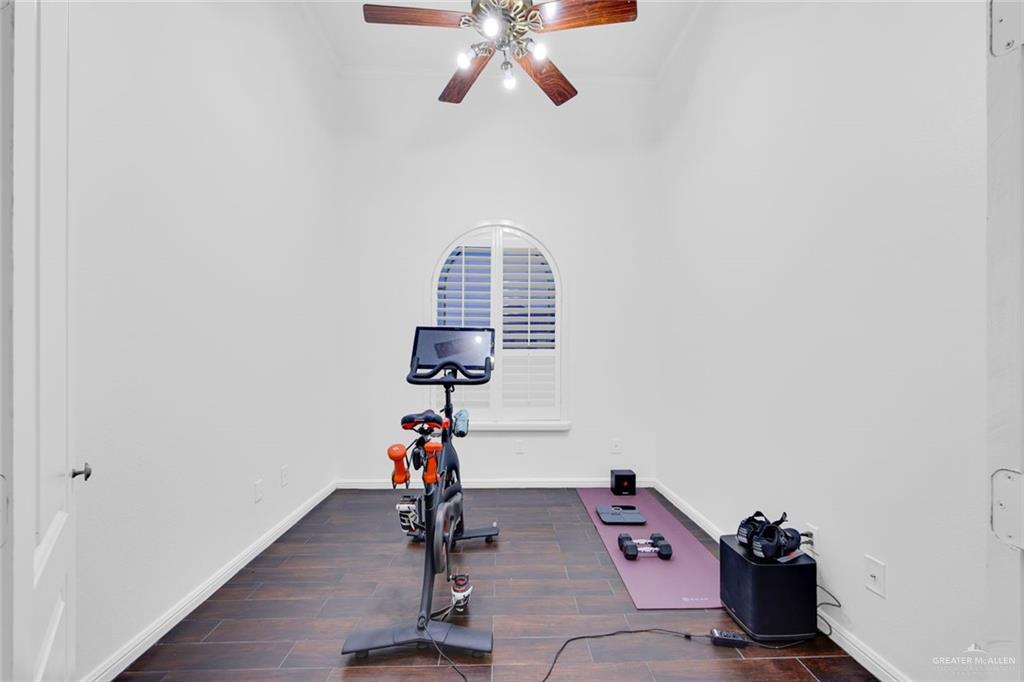 2405 West Rhin Drive Edinburg, TX 78539 - Photo 14 of 26 a room with gym equipment and wooden floor