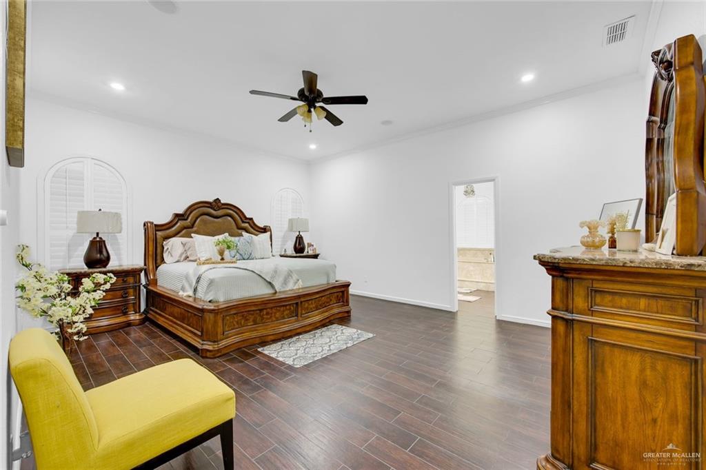 2405 West Rhin Drive Edinburg, TX 78539 - Photo 15 of 26 a bedroom with a bed and wooden floor