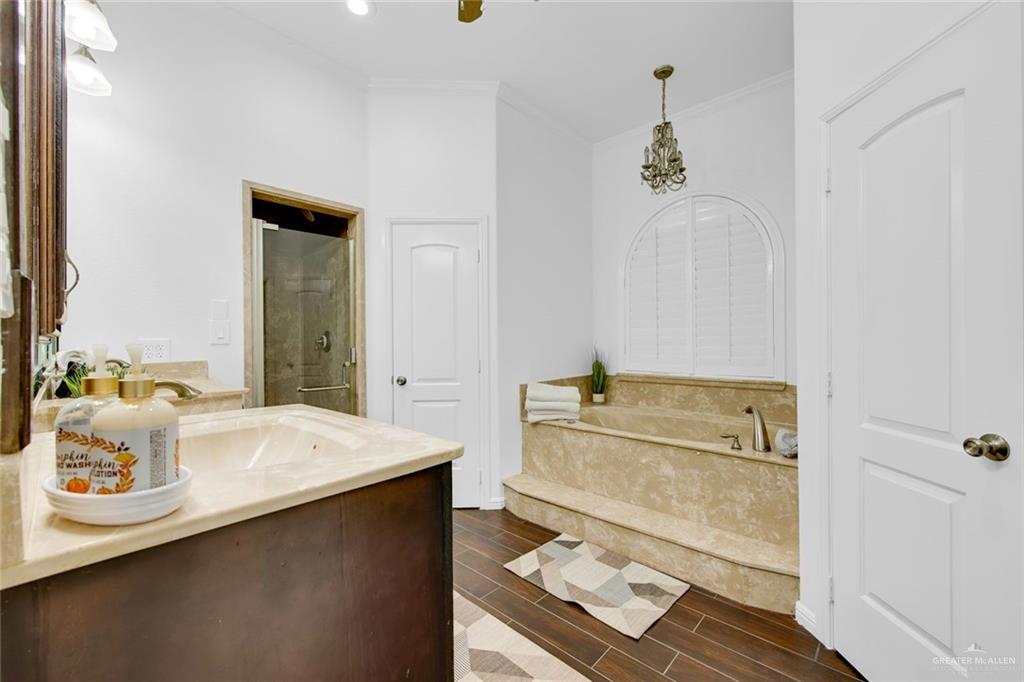 2405 West Rhin Drive Edinburg, TX 78539 - Photo 16 of 26 a bathroom with a tub sink and mirror