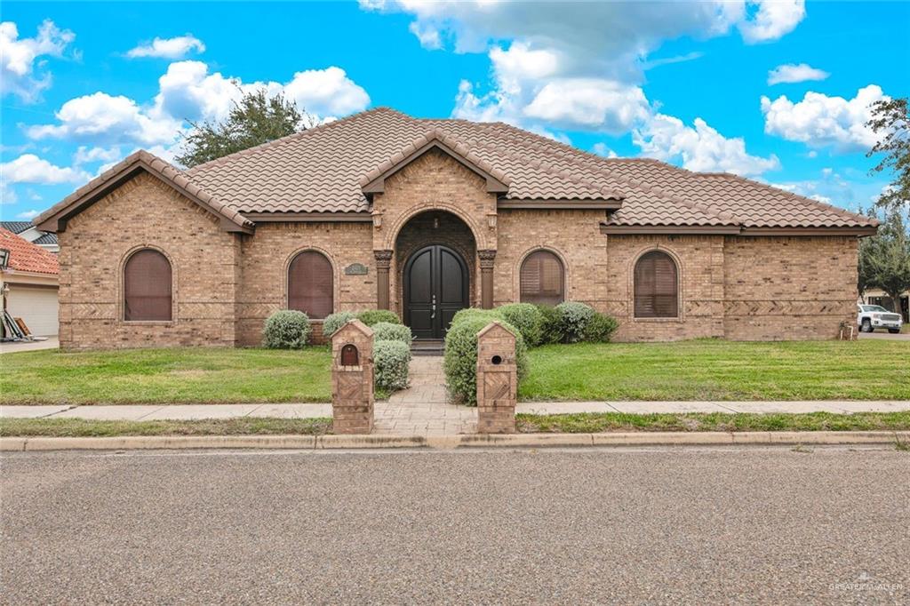 2405 West Rhin Drive Edinburg, TX 78539 - Photo 2 of 26 a front view of house with yard and green space