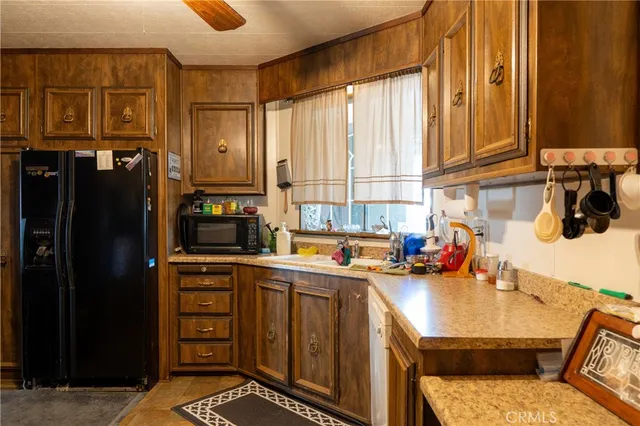 a kitchen with stainless steel appliances a sink stove and cabinets