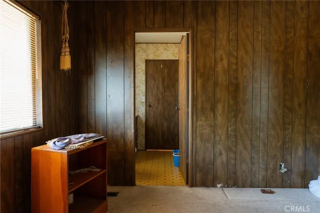 a bathroom with a sink a toilet a mirror and shower curtain