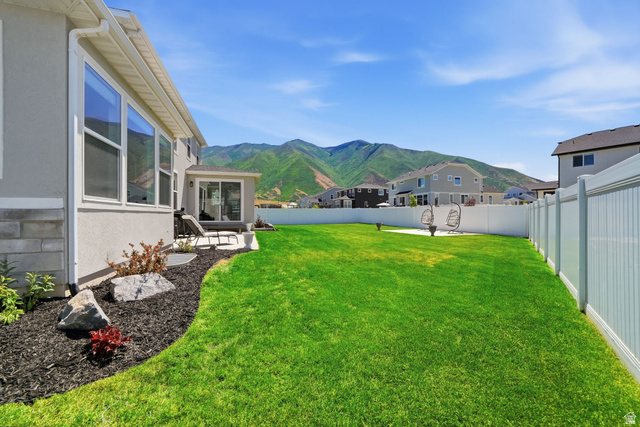 1165 West Union Bench Drive Mapleton, UT 84664 - Photo 53 of 61 Expansive green lawn bordered by a white privacy fence