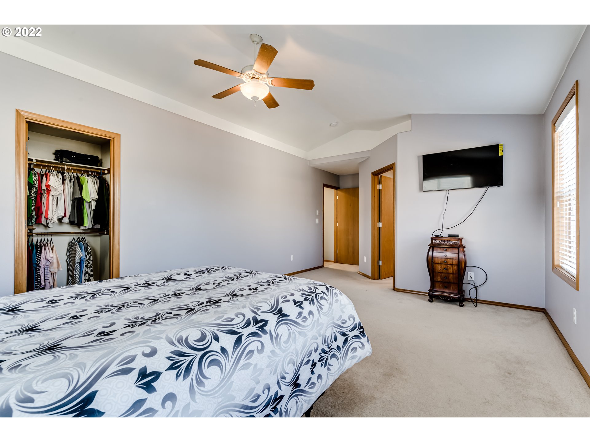 3370 Falcon Drive Springfield, OR 97477 - Photo 19 of 29 a bedroom with a bed and a chandelier