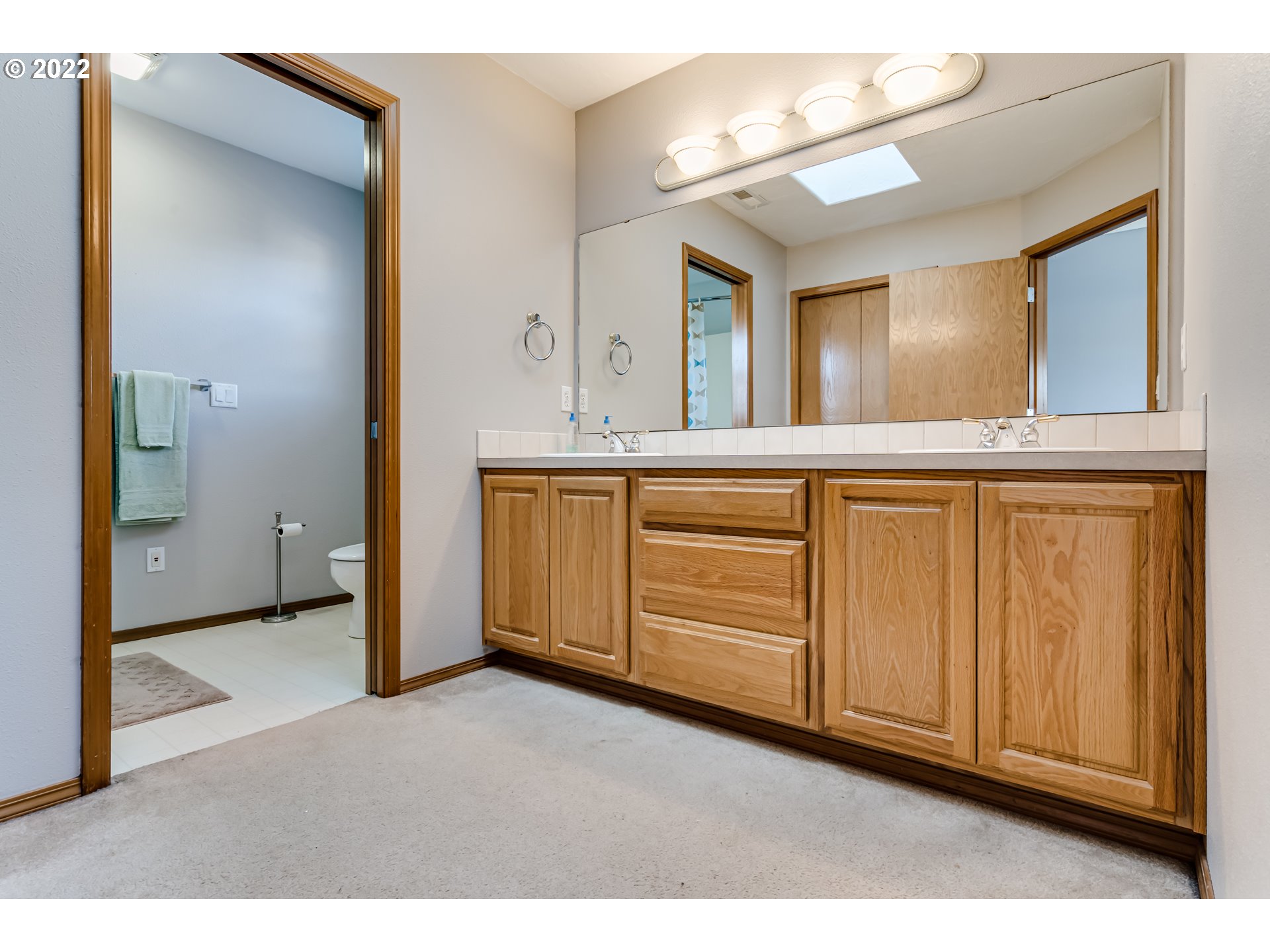 3370 Falcon Drive Springfield, OR 97477 - Photo 21 of 29 a view of a bathroom with mirror and double vanity