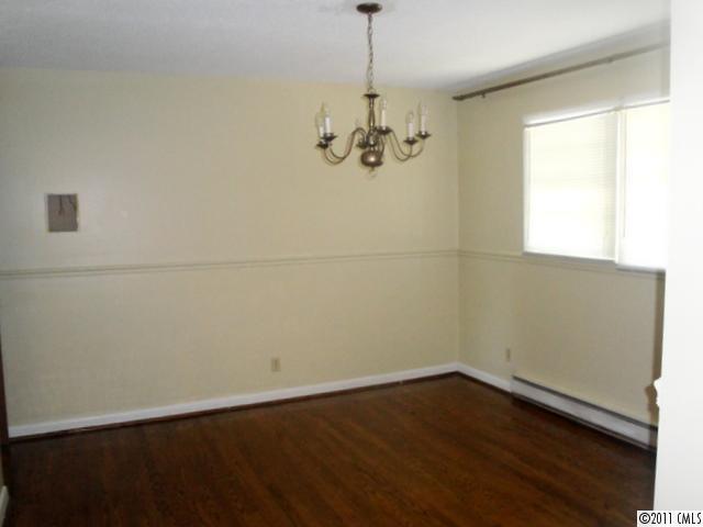1147 Donnybrook Road Catawba, SC 29704 - Photo 3 of 16 an empty room with wooden floor and windows
