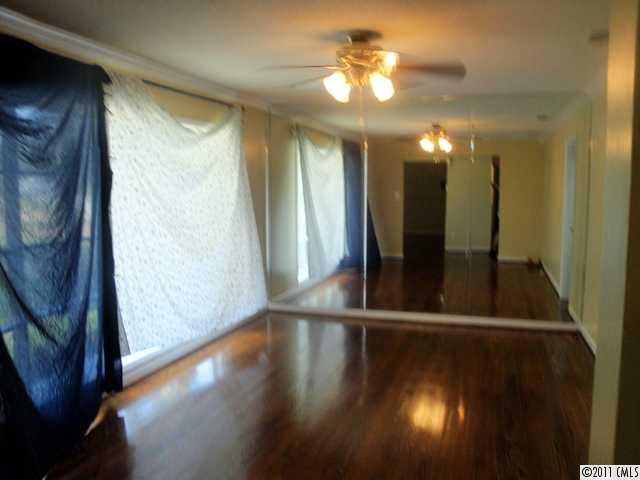 1147 Donnybrook Road Catawba, SC 29704 - Photo 4 of 16 a view of a hallway with wooden floor and a window