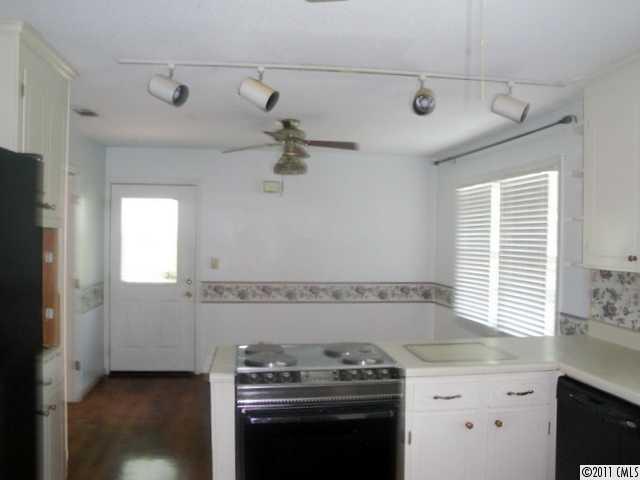 1147 Donnybrook Road Catawba, SC 29704 - Photo 6 of 16 a kitchen with a stove and a sink