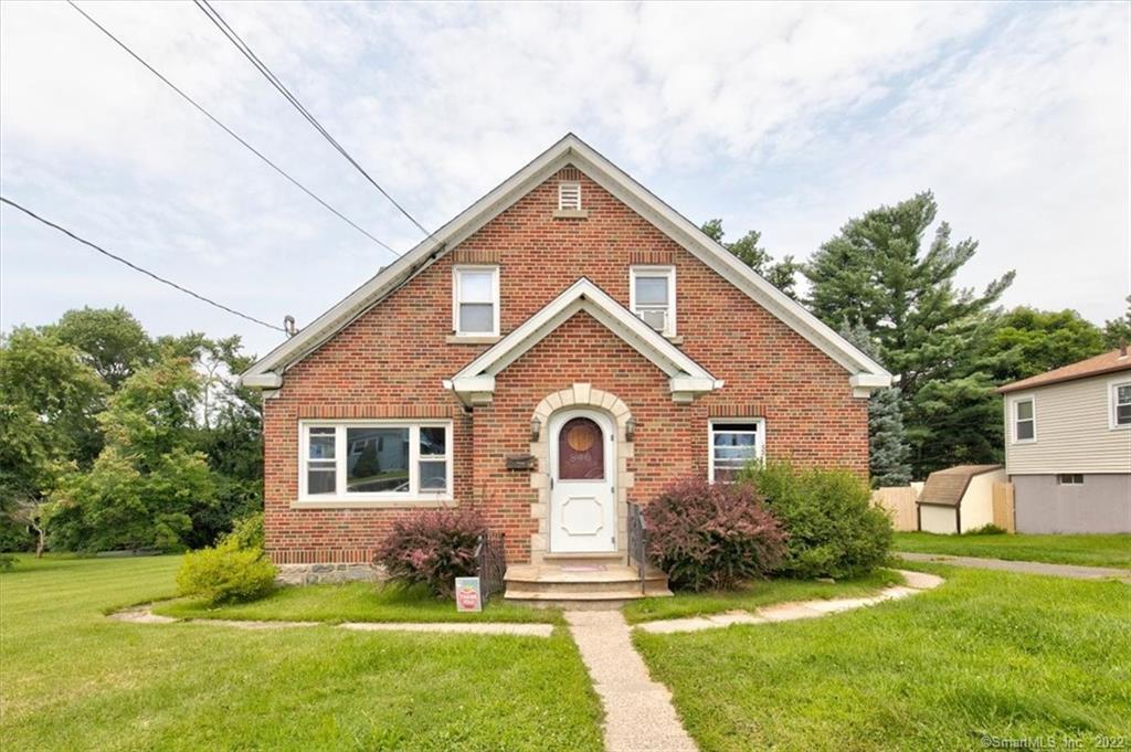 840 Washington Ave Extension Waterbury, CT 06708 - Photo 1 of 1 a front view of a house with a yard
