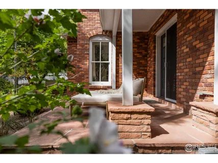 a view of a house with a wooden deck