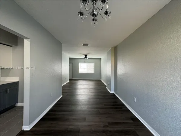 a view of gallery with wooden floor