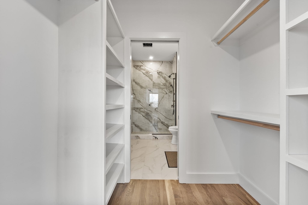 599 Sea Street, Unit 1 Quincy, MA 02169 - Photo 24 of 37 a view of a room with wooden floor
