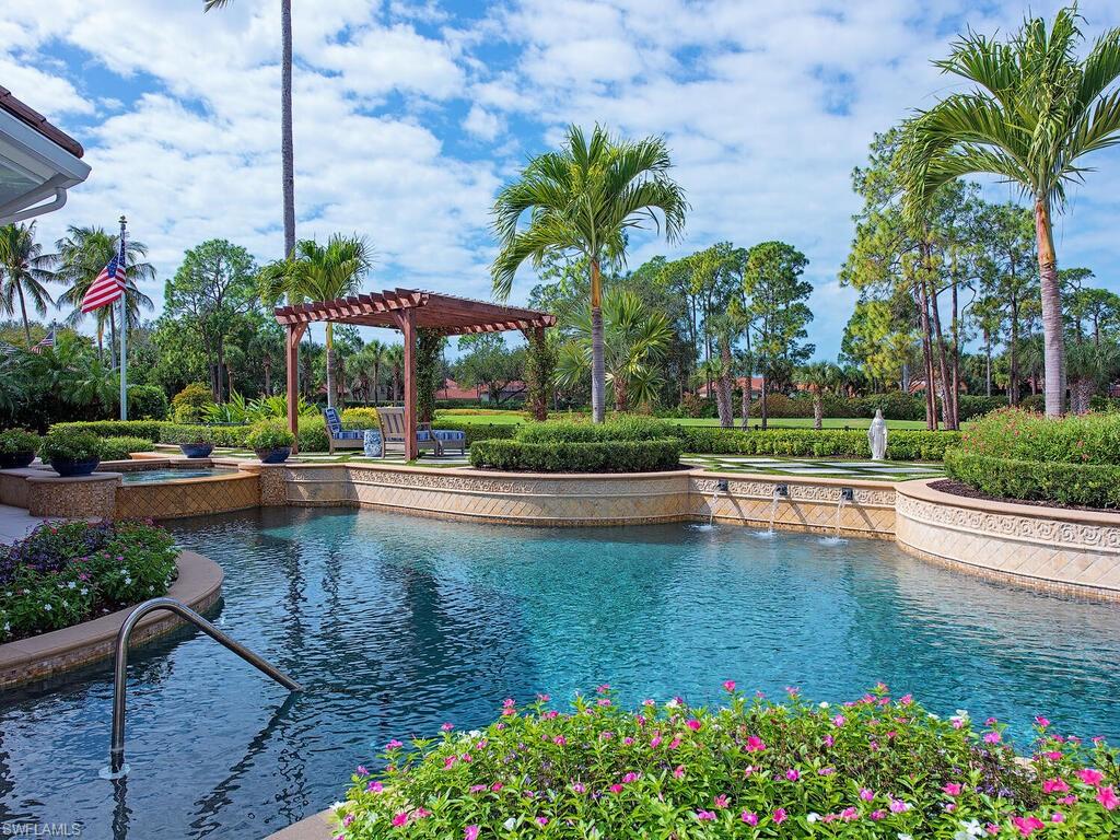 3123 Dahlia Way Naples, FL 34105 - Photo 5 of 29 a view of a swimming pool with a patio