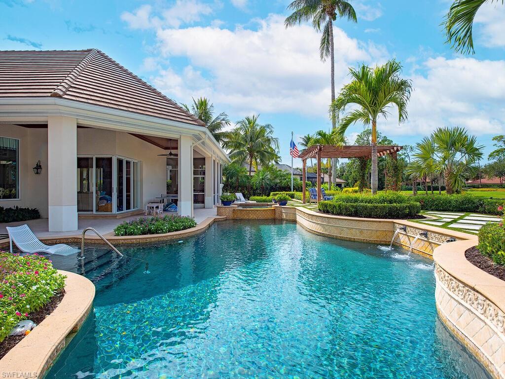 3123 Dahlia Way Naples, FL 34105 - Photo 6 of 29 a view of a house with swimming pool and sitting area