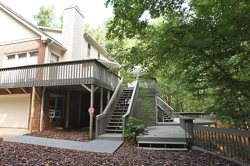 12332 Galway Drive Raleigh, NC 27613 - Photo 25 of 25 Backyard, deck and covered back storage area. Exterior Back