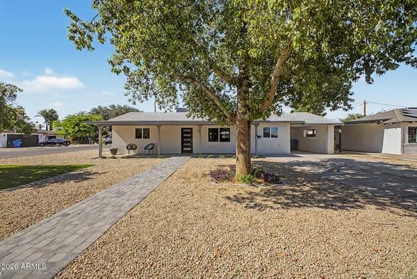 front view of a house with a yard