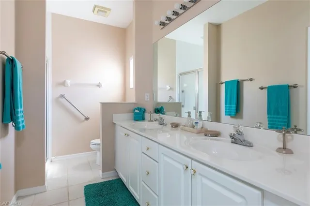 a bedroom with a bed and large window