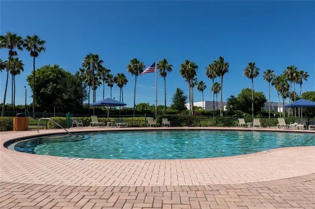 a view of a chairs and an umbrella in the garden