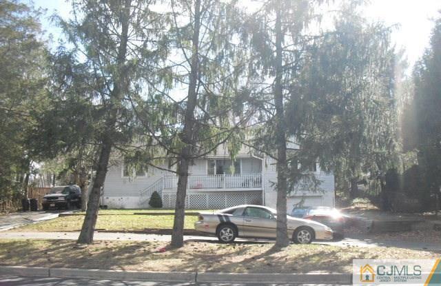 143 Milltown Road East Brunswick, NJ 08816 - Photo 1 of 6 a view of a yard in front of a house