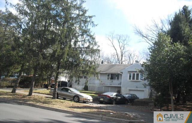 143 Milltown Road East Brunswick, NJ 08816 - Photo 2 of 6 a front view of a house with a yard
