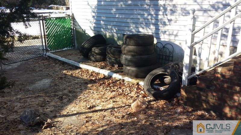 143 Milltown Road East Brunswick, NJ 08816 - Photo 6 of 6 a view of a backyard with pathway