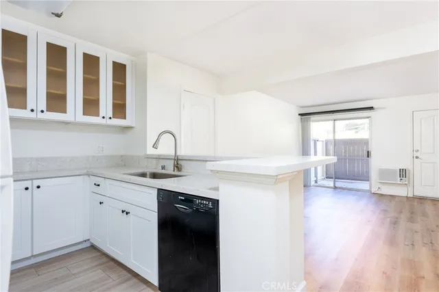a kitchen with a sink and cabinets