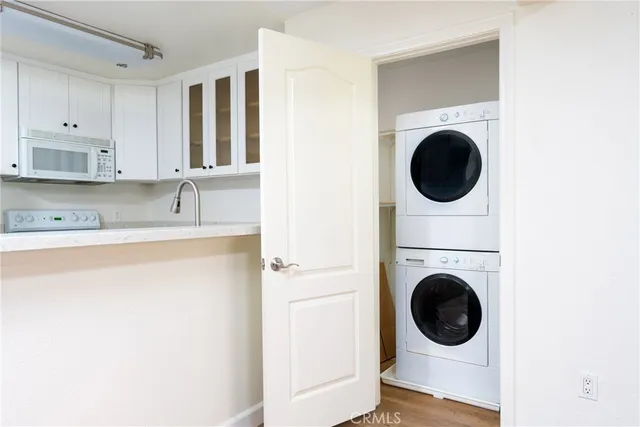 a kitchen with a washer and dryer