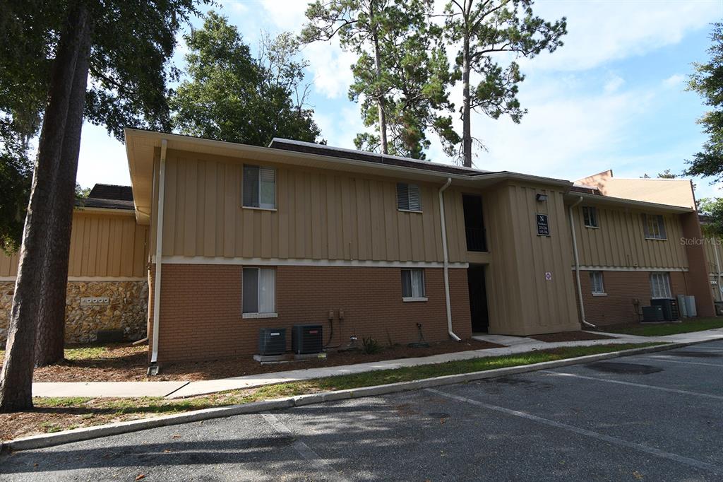507 Northwest 39th Road, Unit 215 Gainesville, FL 32607 - Photo 1 of 21 a view of a house with a tree
