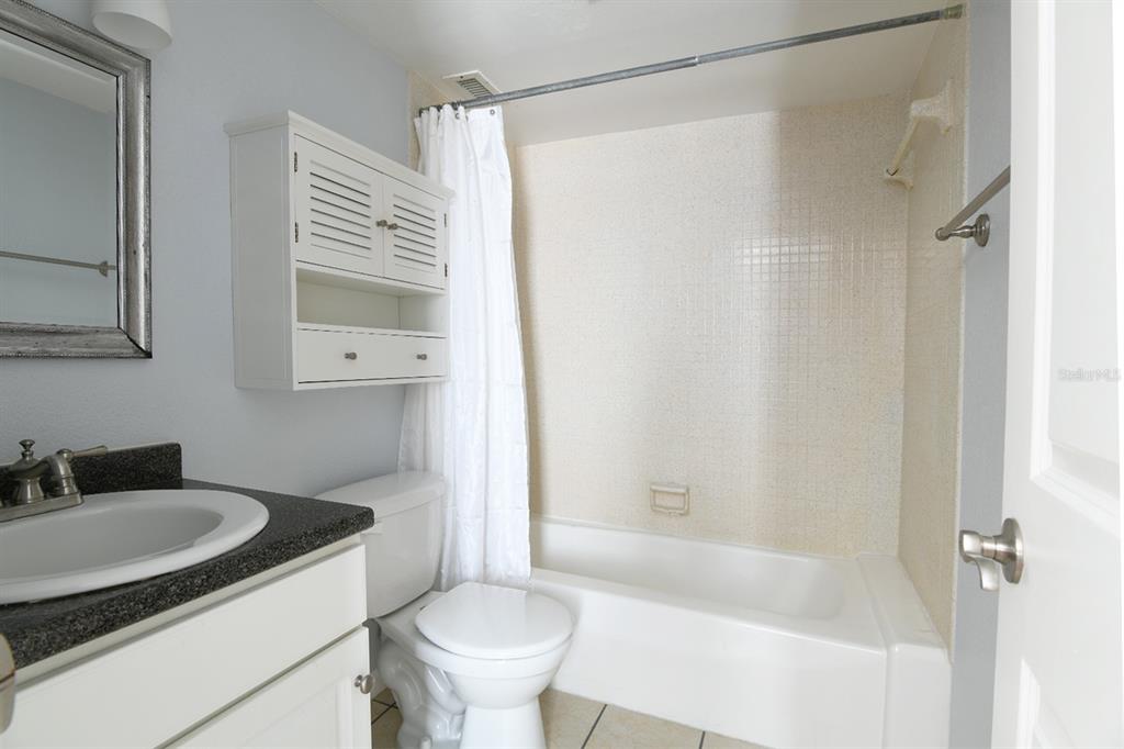 507 Northwest 39th Road, Unit 215 Gainesville, FL 32607 - Photo 11 of 21 a bathroom with a sink toilet and shower