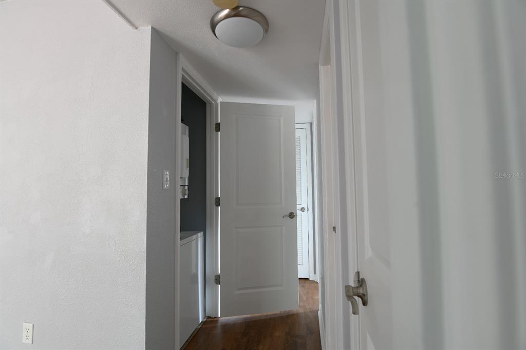 507 Northwest 39th Road, Unit 215 Gainesville, FL 32607 - Photo 14 of 21 a view of a bathroom from a corridor