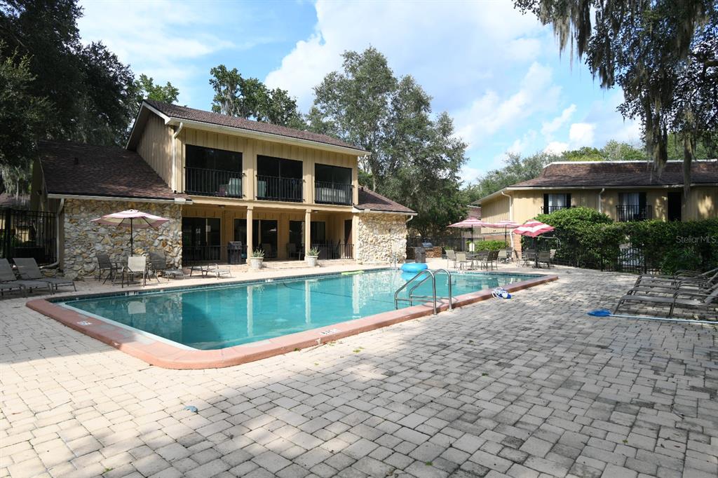 507 Northwest 39th Road, Unit 215 Gainesville, FL 32607 - Photo 15 of 21 a front view of a house with a yard