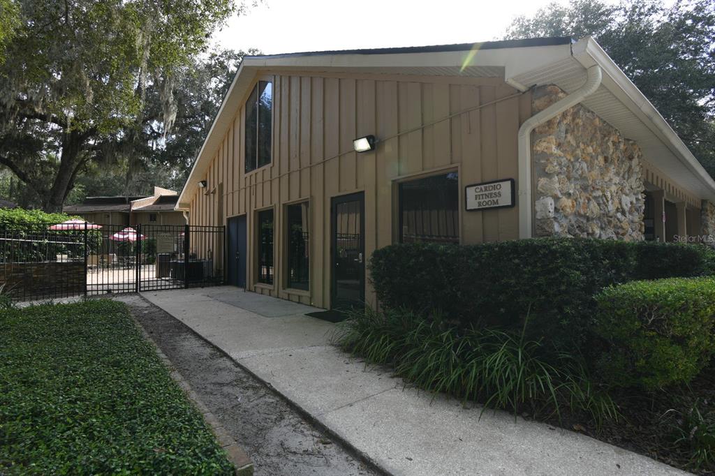 507 Northwest 39th Road, Unit 215 Gainesville, FL 32607 - Photo 19 of 21 a backyard of a house with lots of green space