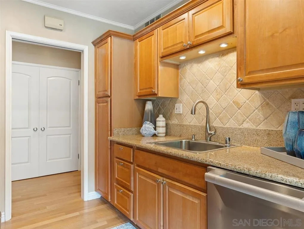 230 Prospect Street, Unit 17 La Jolla, CA 92037 - Photo 11 of 25 a bathroom with a sink and a mirror