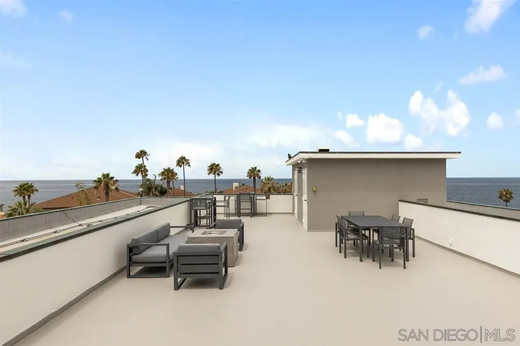 230 Prospect Street, Unit 17 La Jolla, CA 92037 - Photo 21 of 25 a terrace with outdoor seating and trees