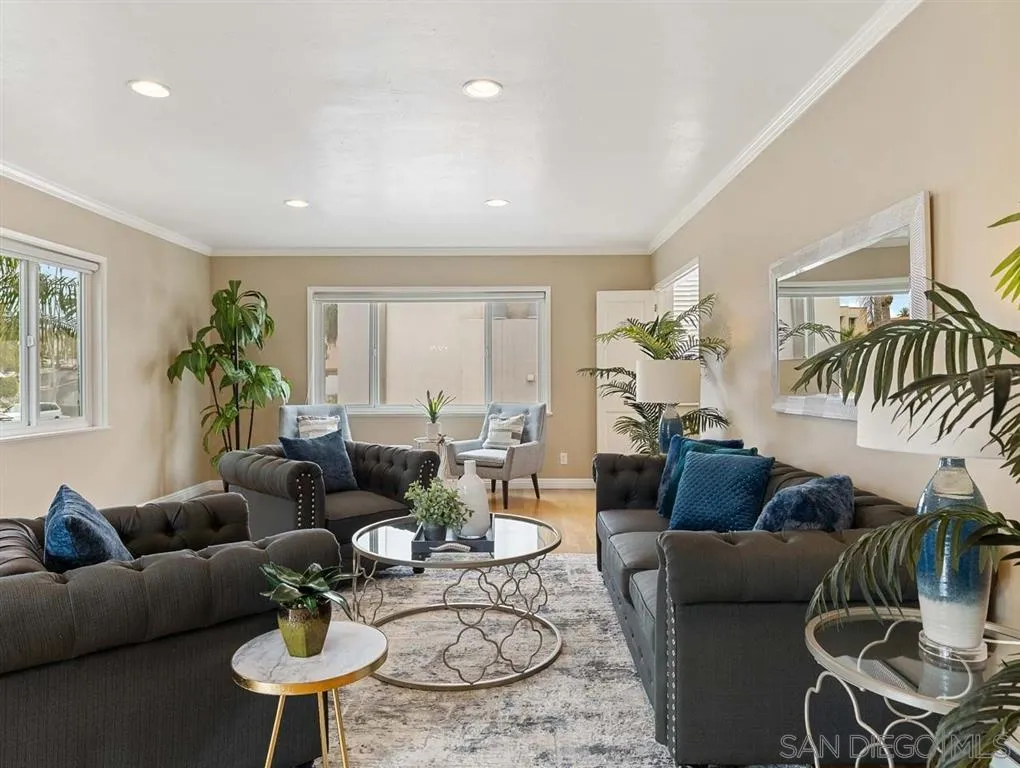 230 Prospect Street, Unit 17 La Jolla, CA 92037 - Photo 6 of 25 a living room with furniture potted plant and a window