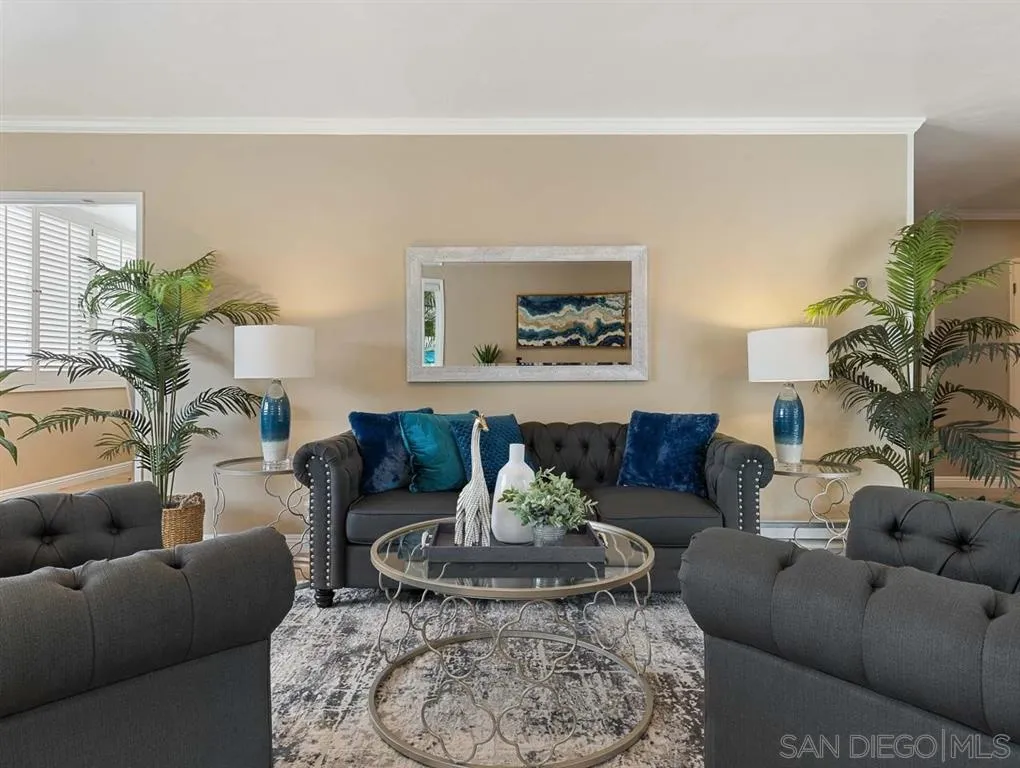 230 Prospect Street, Unit 17 La Jolla, CA 92037 - Photo 7 of 25 a living room with furniture and a potted plant