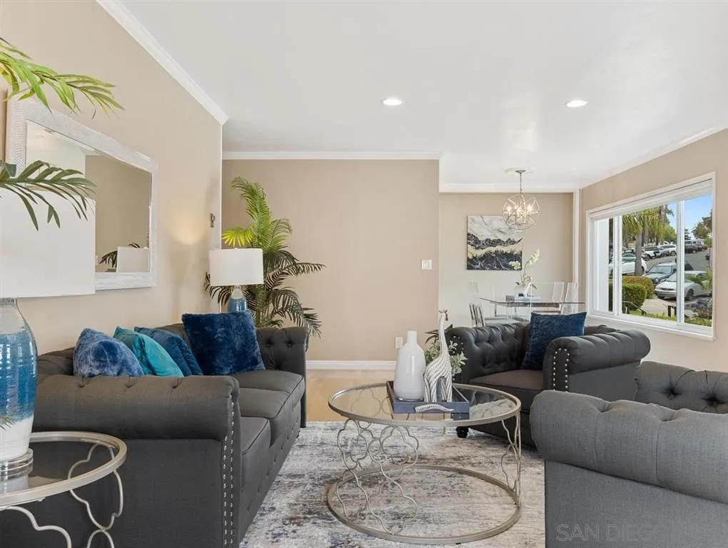 230 Prospect Street, Unit 17 La Jolla, CA 92037 - Photo 8 of 25 a living room with furniture and a large window
