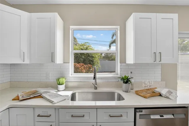 a kitchen with sink and window