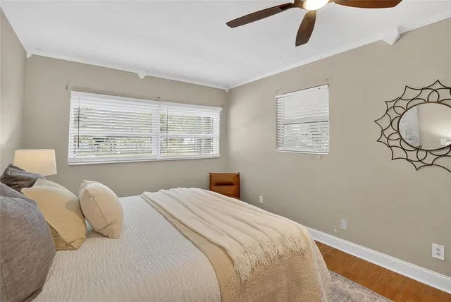 a bedroom with a large bed and a window