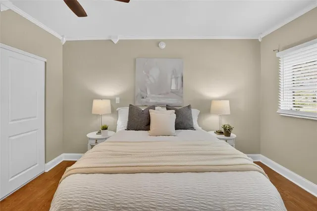 a bedroom with a bed and a window