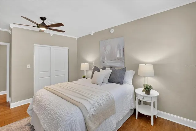 a bedroom with a bed and a lamp