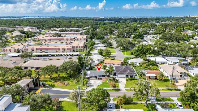an aerial view of residential building with outdoor space and lake view