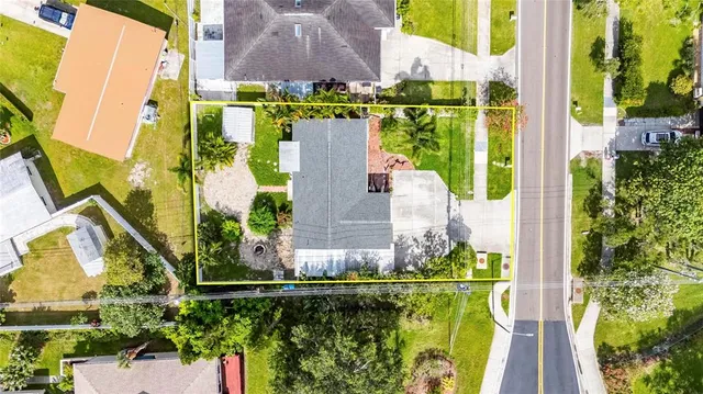 a view of swimming pool with a fountain in front of house