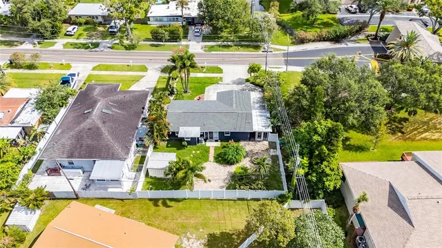 an aerial view of a house with swimming pool