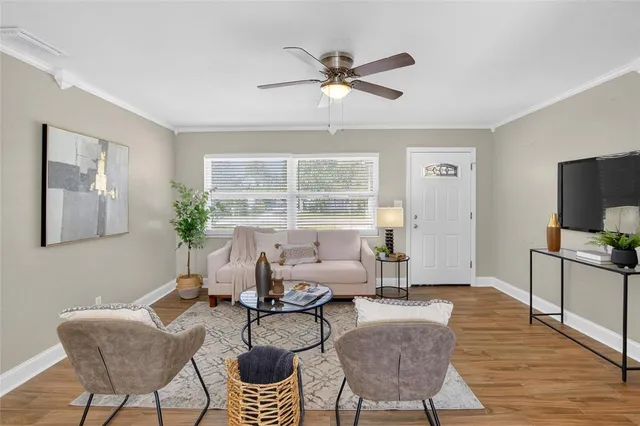 a living room with furniture and a window