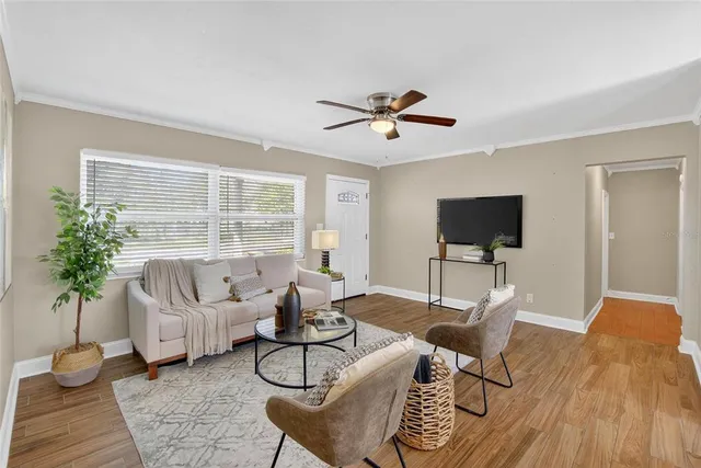 a living room with furniture and a flat screen tv