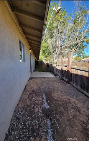 a view of a backyard of the house