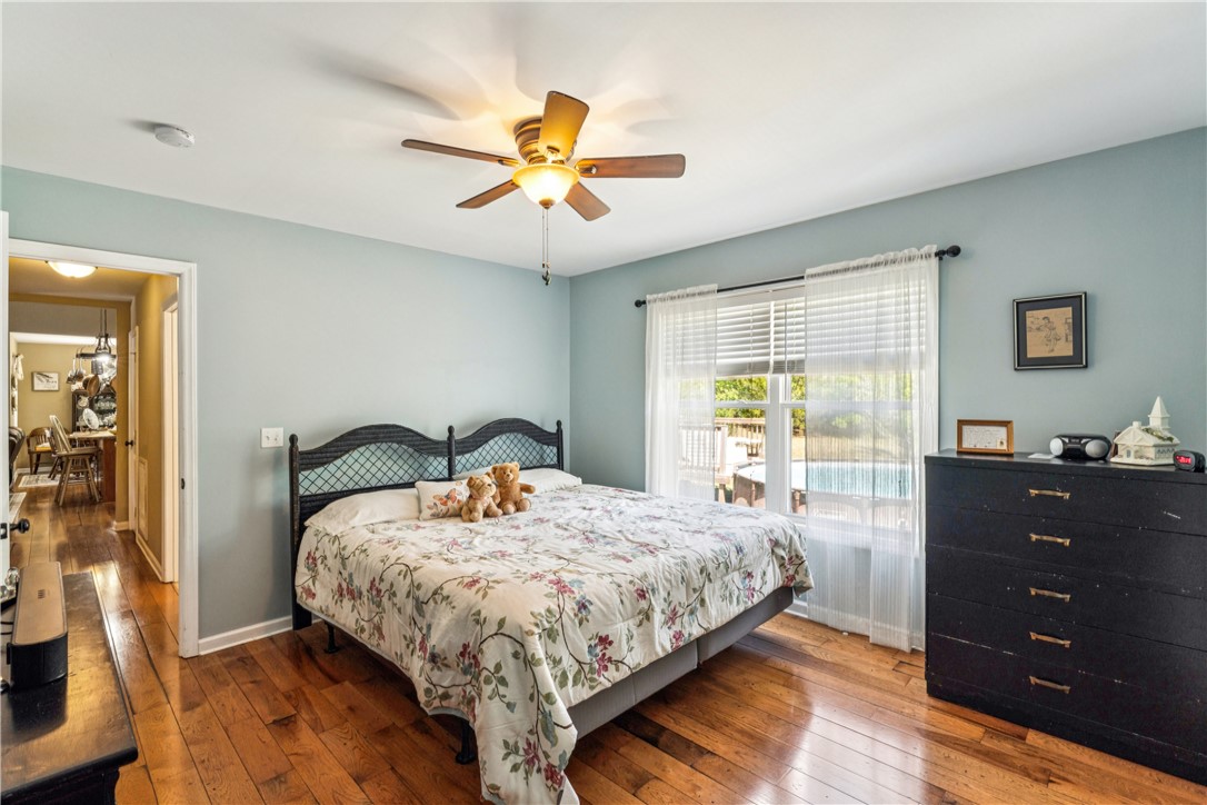 189 Little Choestoea Road Westminster, SC 29693 - Photo 19 of 38 This cozy bedroom features warm hardwood floors and a bright window overlooking the outdoor pool.