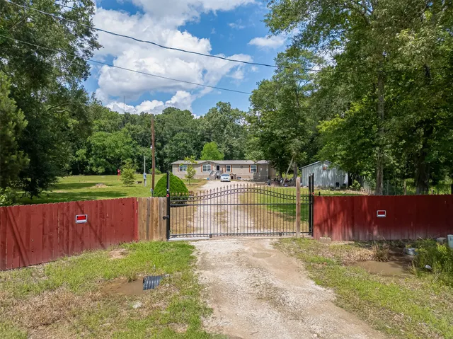 a view of park with wooden fence